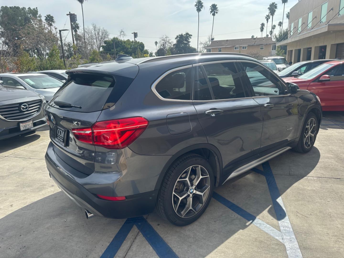 2016 Gray /Black BMW X1 leather (WBXHT3Z34G4) with an 4 CYLINDER engine, Automatic transmission, located at 30 S. Berkeley Avenue, Pasadena, CA, 91107, (626) 248-7567, 34.145447, -118.109398 - Crown City Motors is a used “Buy Here Pay Here” car dealer in Pasadena CA. “Buy Here Pay Here” financing, means that when you purchase your vehicle from our dealership, that you make the payments to the dealership as well. We do not need the banks approval to get you approved for a used auto - Photo#5